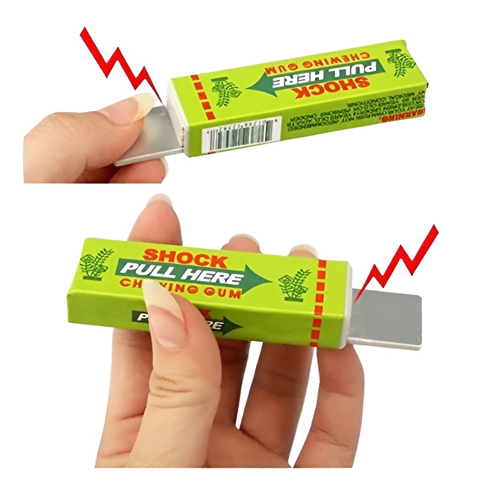 Green chewing gum – style electric shock prank toy with pull – out tab
