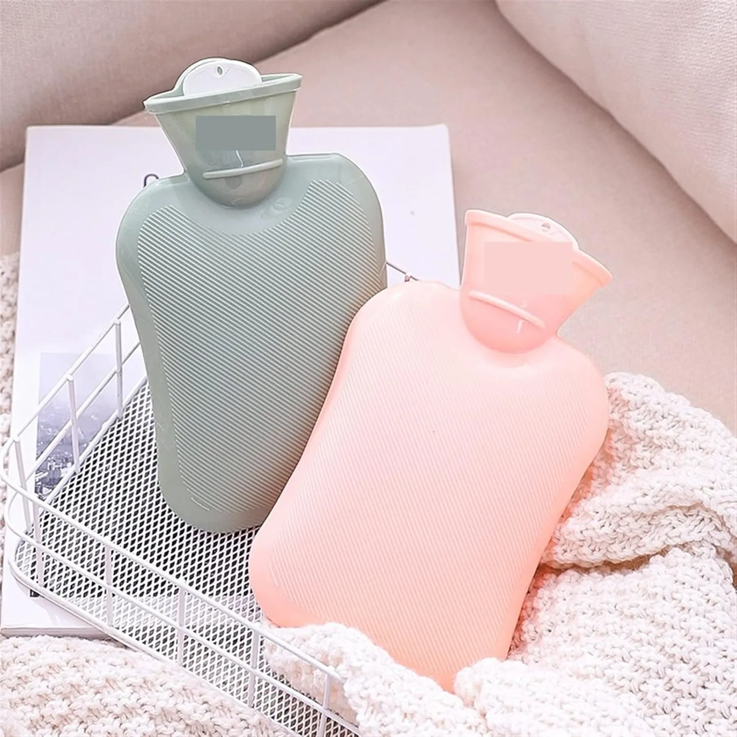 Pink and Grey 1L rubber hot water bags with textured surfaces